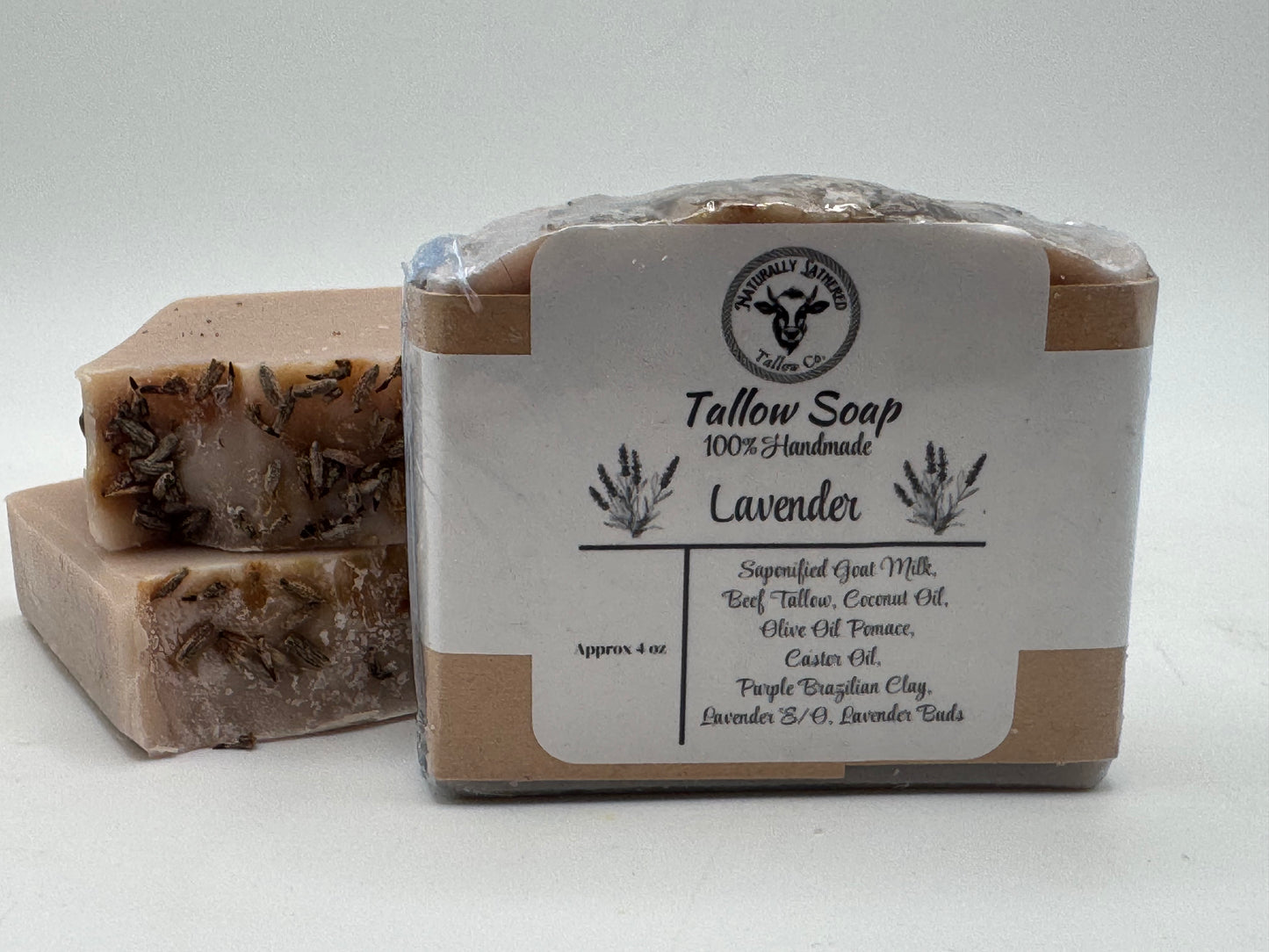 Tallow soap with lavender scent in a clear plastic wrap on a white background