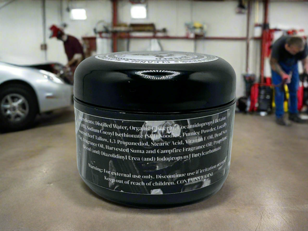 Black jar with label on a concrete floor in a garage setting