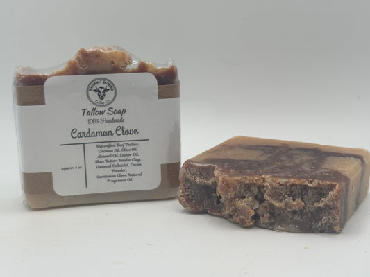 Bar of Tallow Soap with Cardamom Clove fragrance next to its packaging on a white background