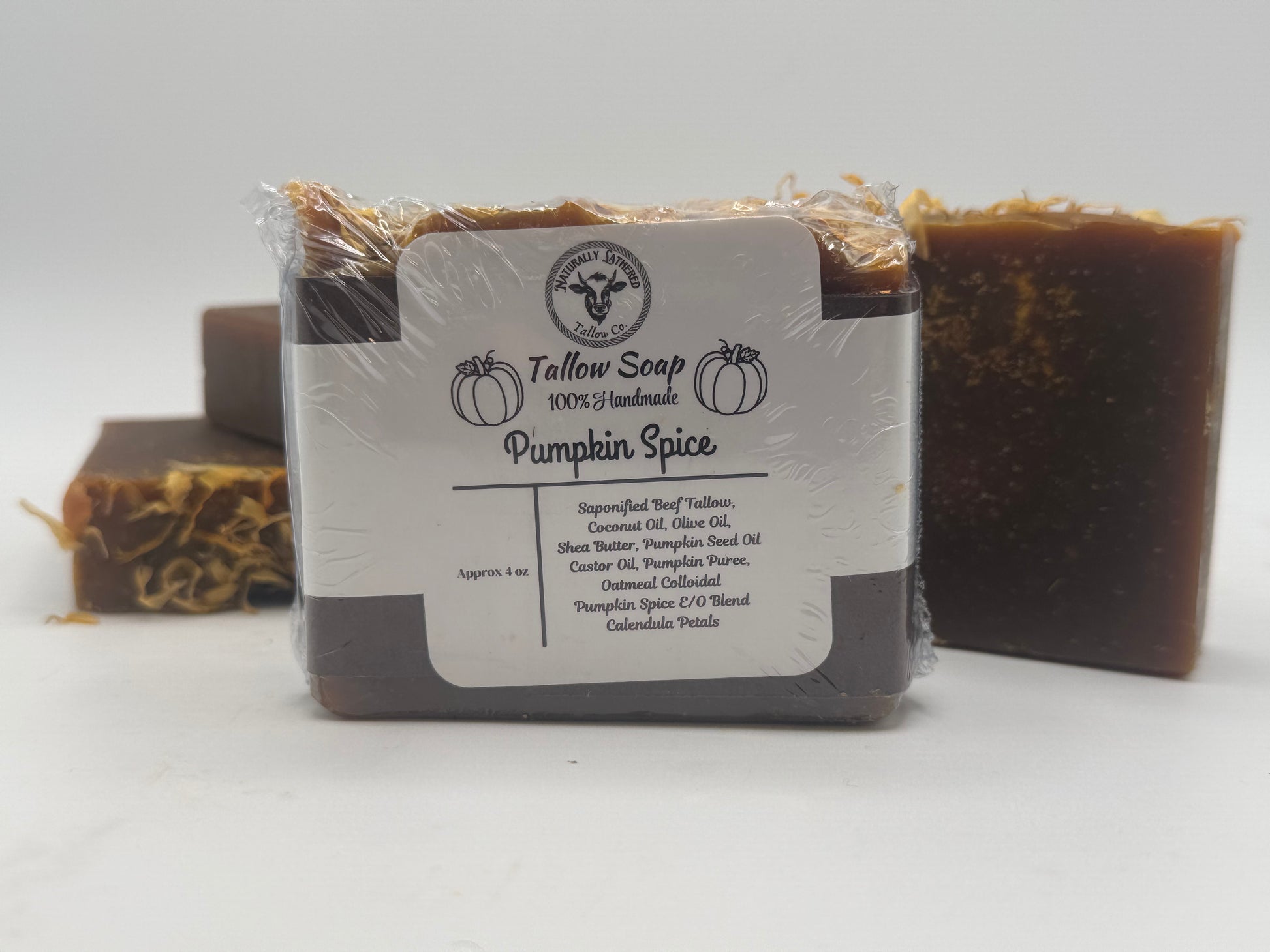 Bar of soap labeled 'Pumpkin Spice' with a visible brand logo on a white background