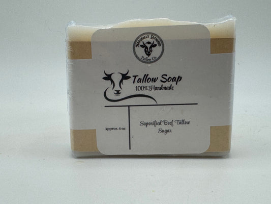 Tallow soap bar with a label on a white background