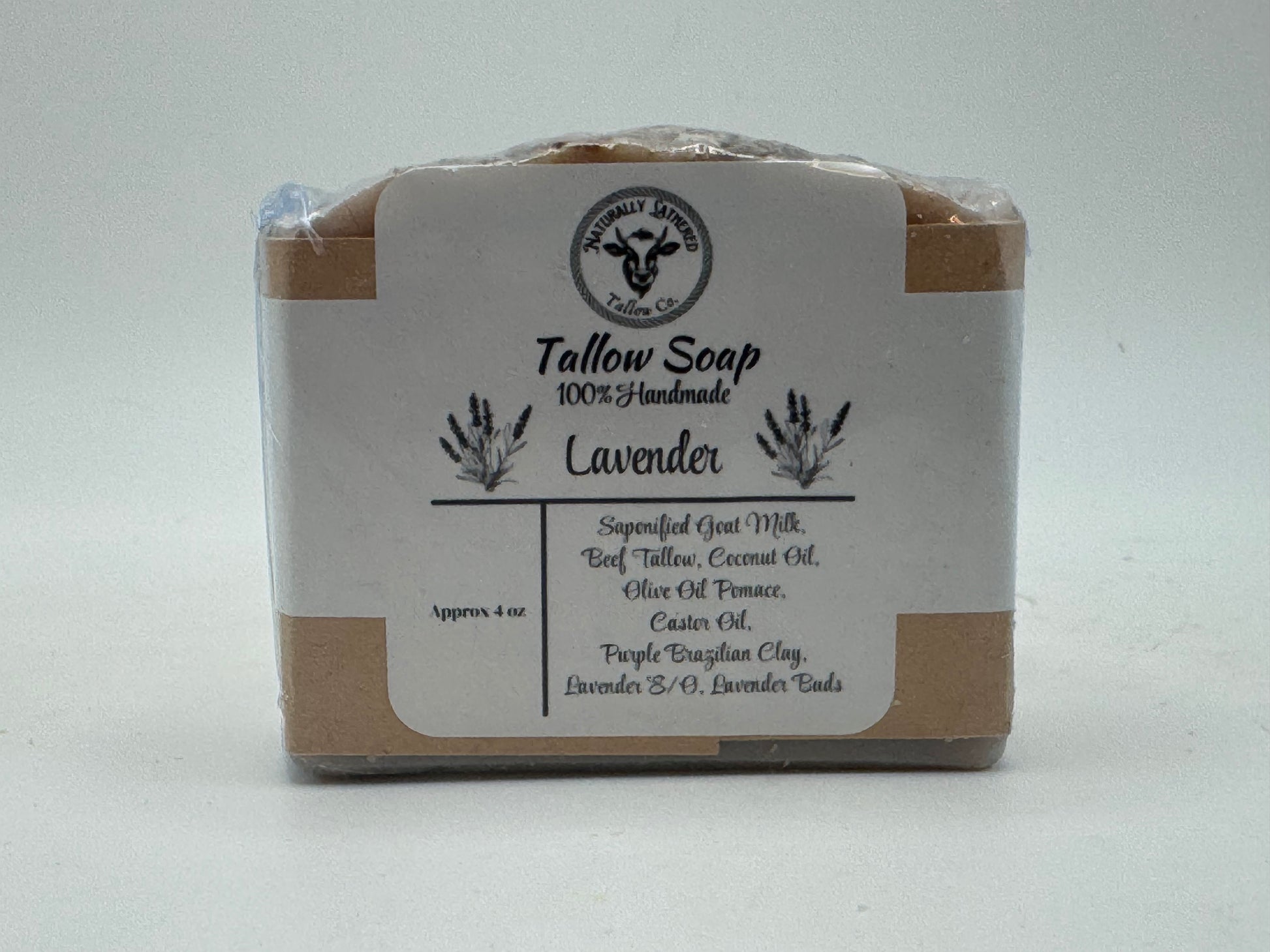 Bar of lavender soap with a label on a light gray background