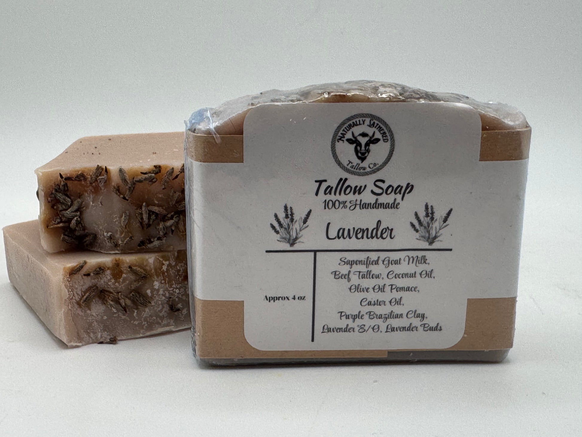 Tallow soap with lavender scent in a clear plastic wrap on a white background
