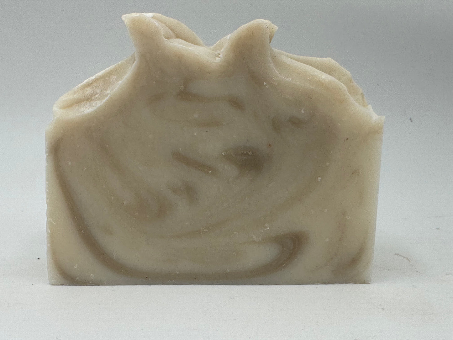 Bar of soap with a swirling pattern on a white background