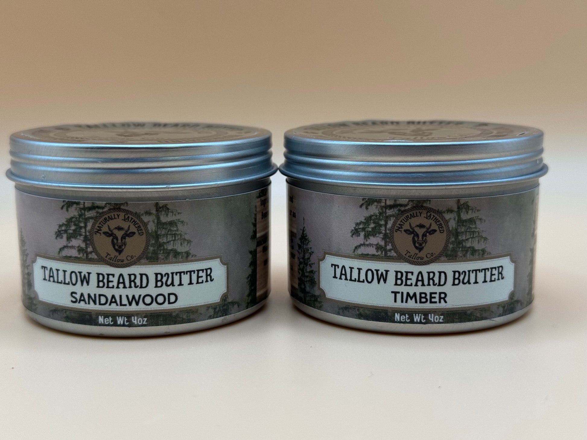 Two tins of Tallow Beard Butter with labels on a beige background