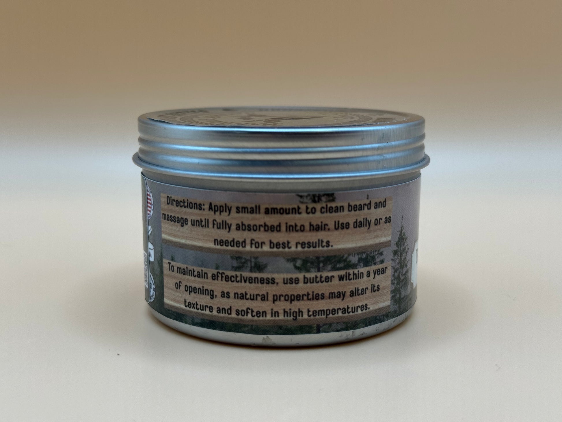 Jar of hair product with label on a white background