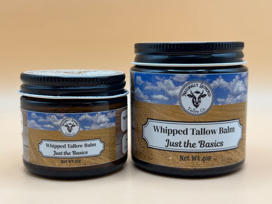 Two jars of Whipped Tallow Balm with labels on a beige background