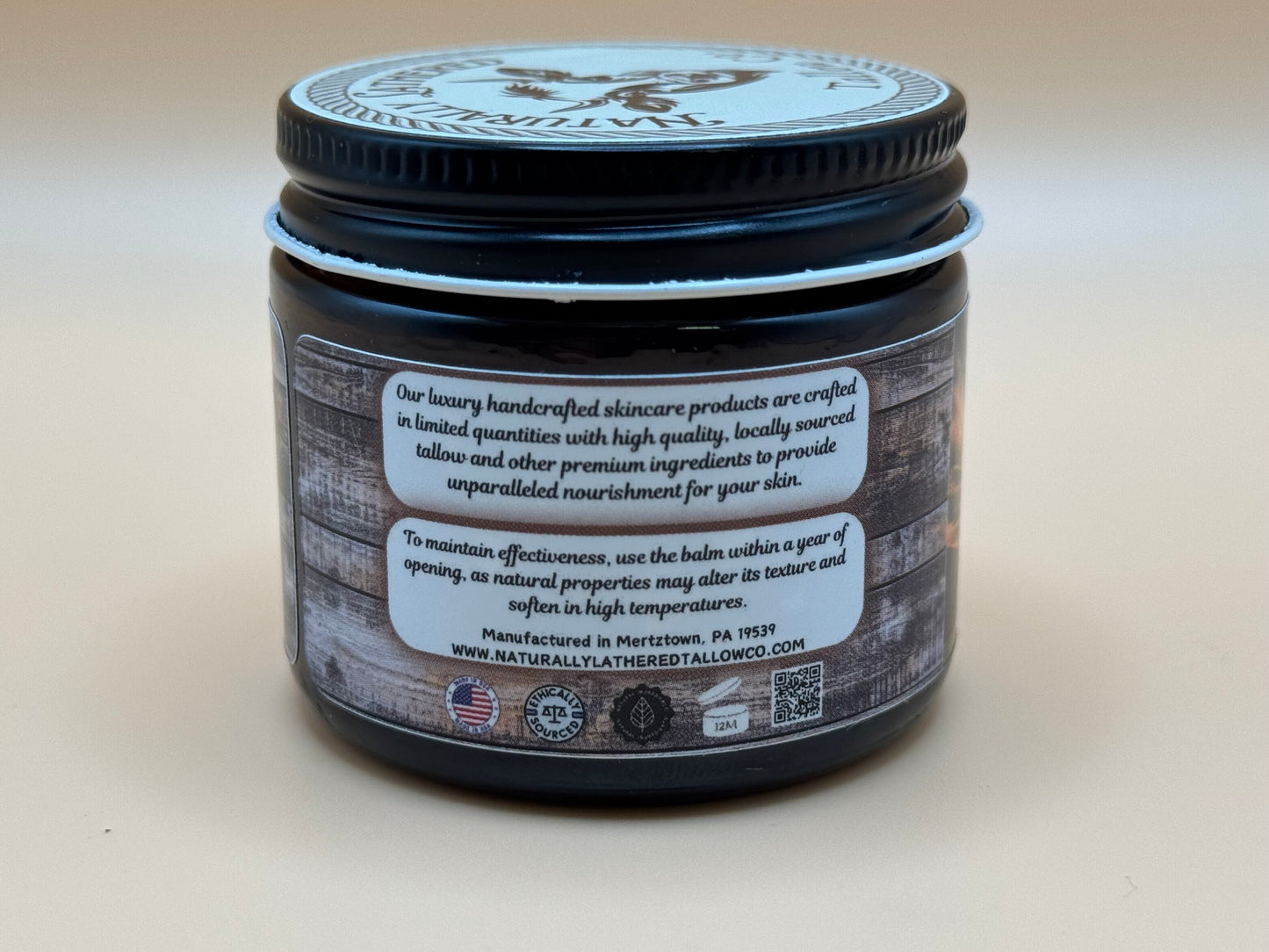 Skincare product jar with label on a beige background