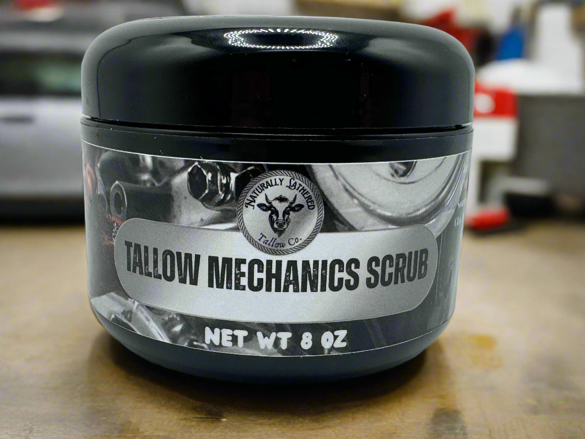 Jar of Tallow Mechanics Scrub with a black lid on a blurred background