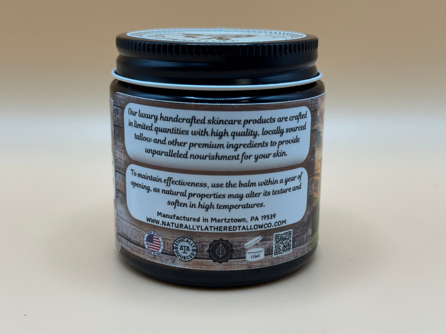 Skincare product jar with label on a beige background