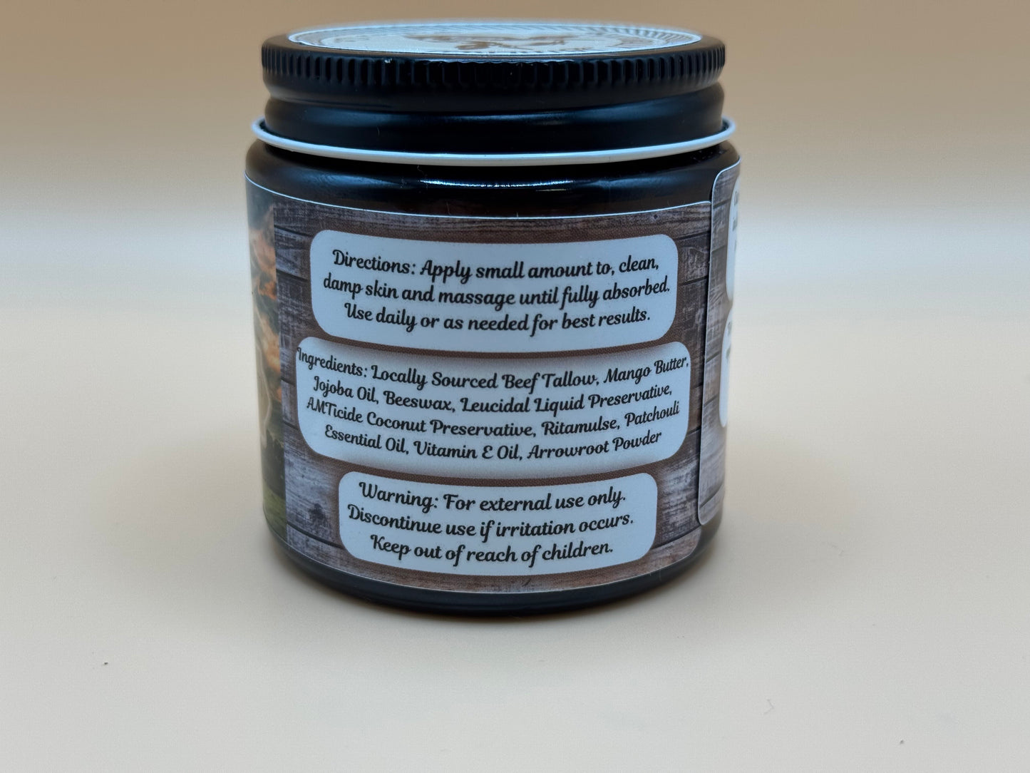 Jar of cream with a label on a light gray background