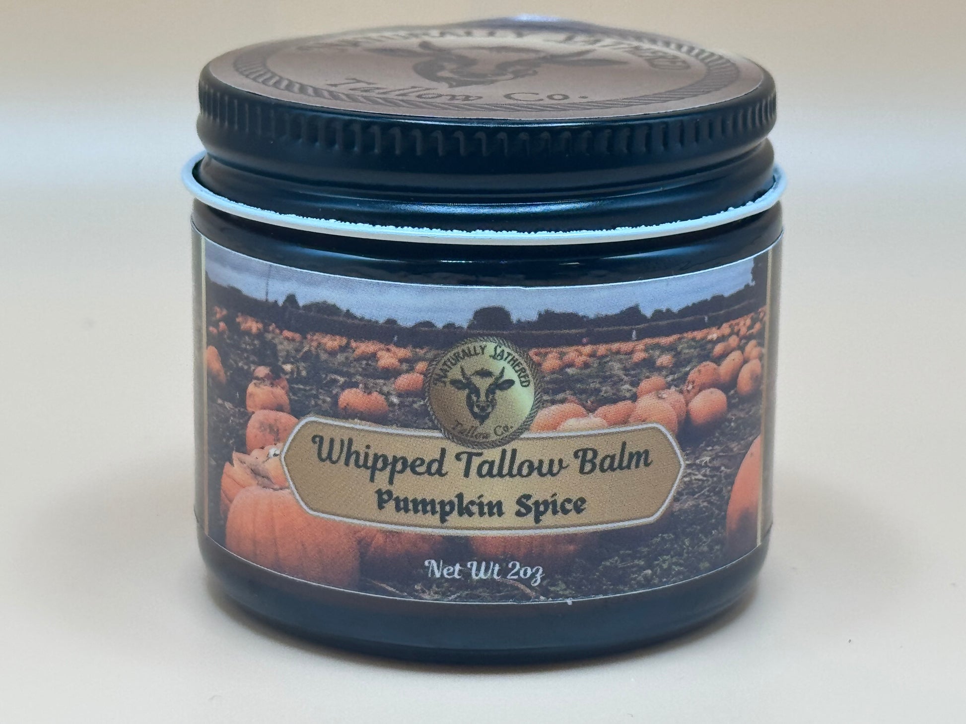 Jar of Whipped Tallow Balm with Pumpkin Spice scent on a white background