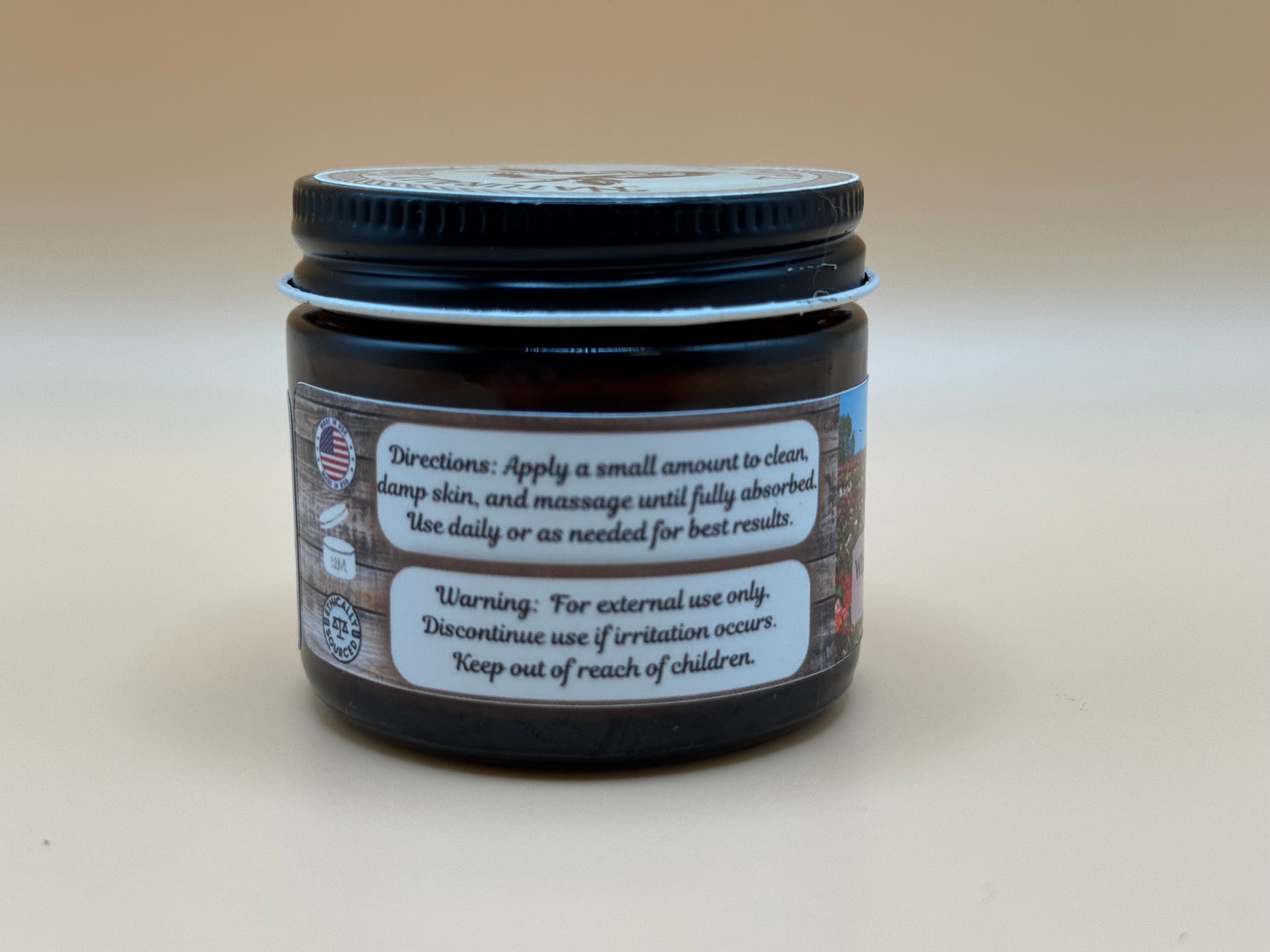 Jar of cream with label on a beige background
