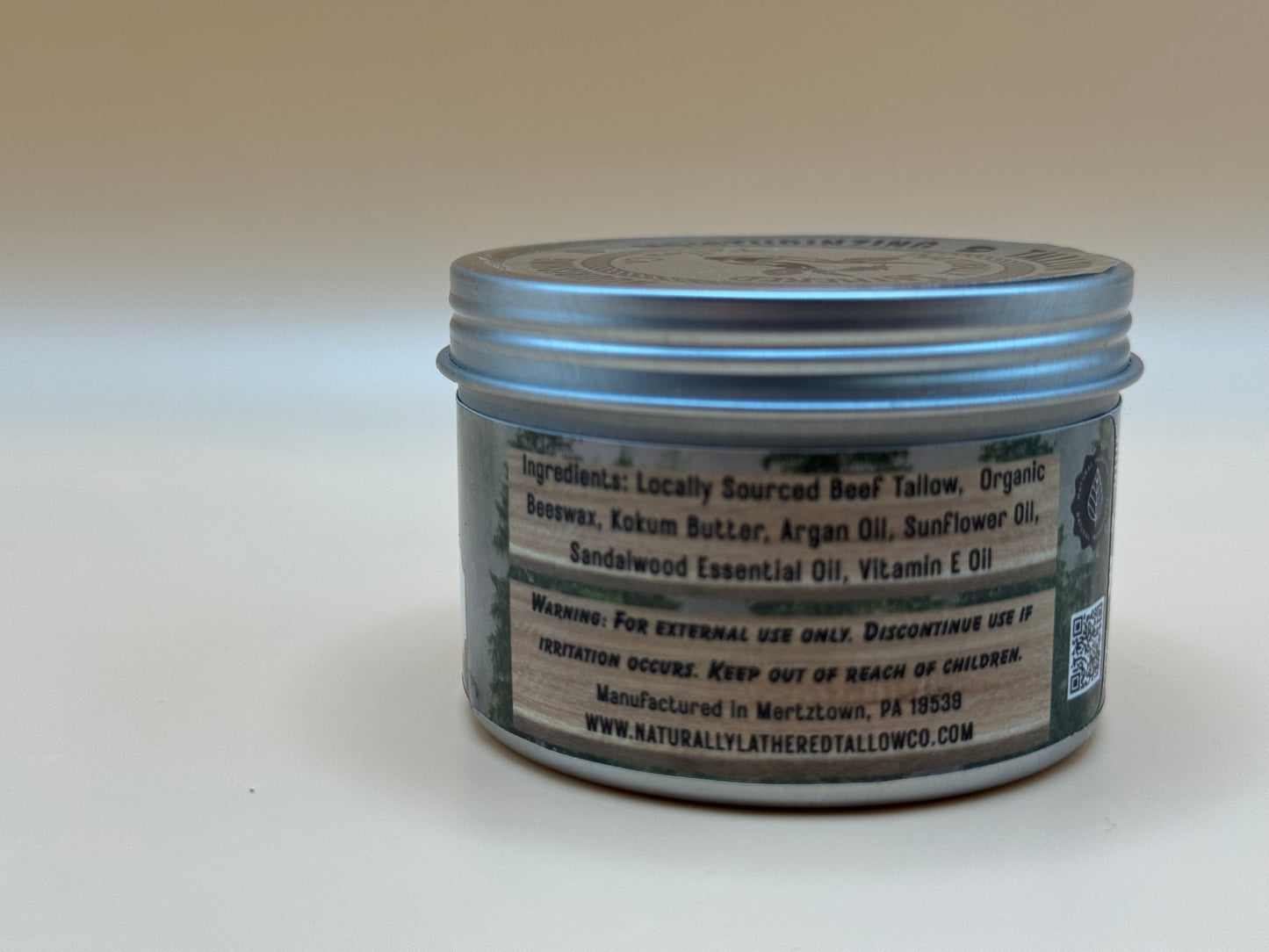 Jar of balm with label on a white background