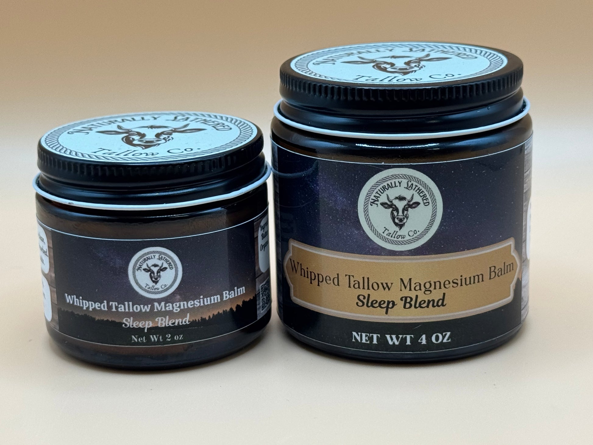 Two jars of Whipped Tallow Magnesium Balm from Naturally Lavish Co. on a beige background.