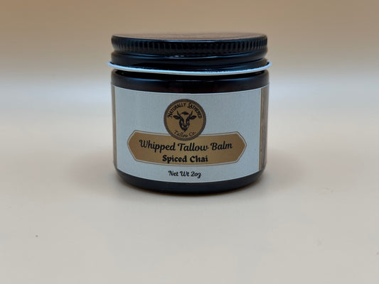 Jar of Whipped Tallow Balm with Spiced Chai scent on a beige background